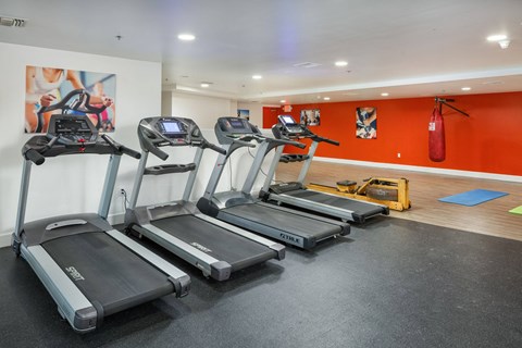 a gym with cardio machines and a fire hydrant at The Social Apartments, North Hollywood, 91601